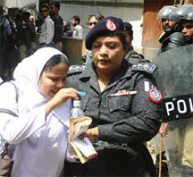 Pakistani nurse with police escort